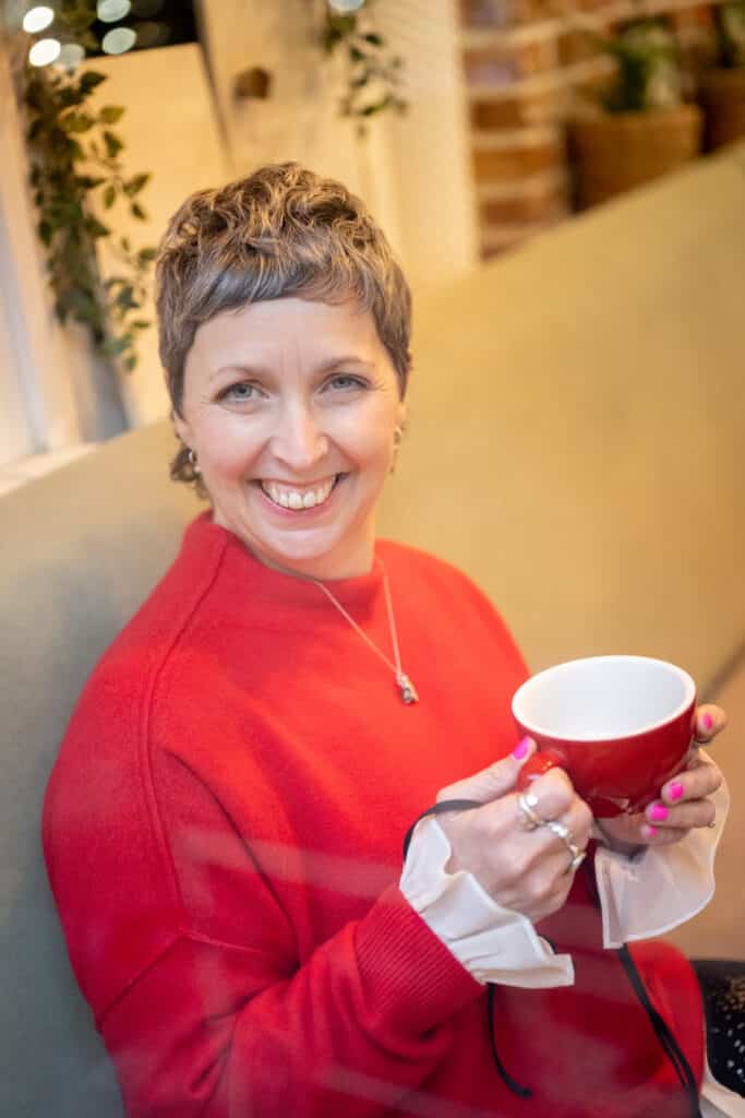 Photo of Sharon Worth enjoying a hot drink.
