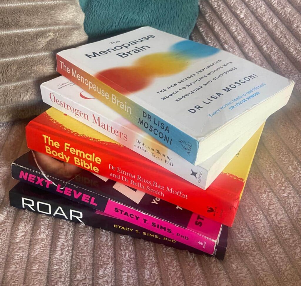 A pile of women's wellbeing books